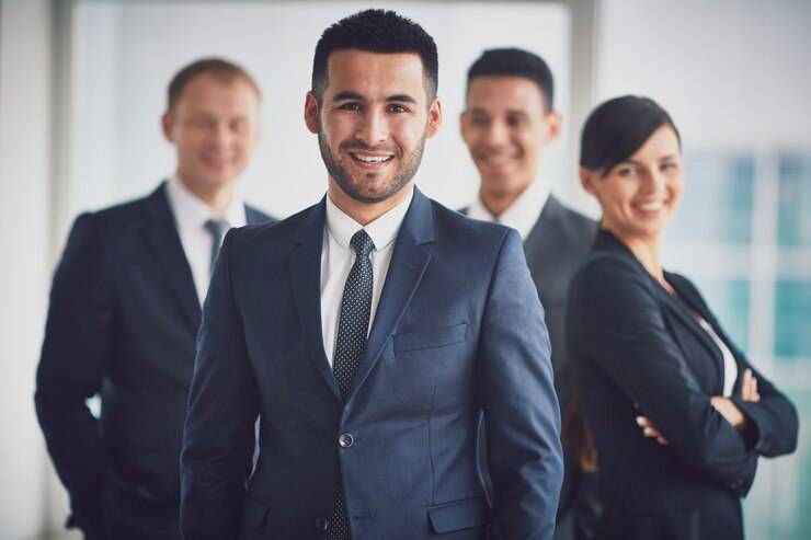 About us 1 confident business team with leader 1098 3228